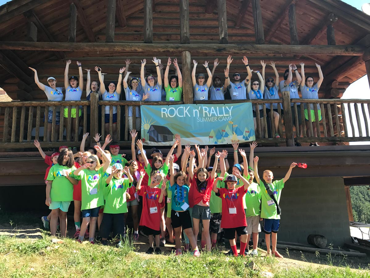 Campers and counselors pose for a photo at Rock and Rally camp