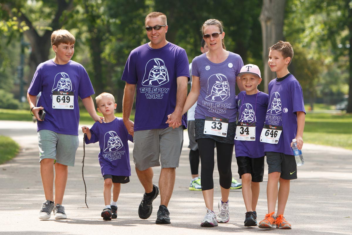 A family walks together at the Walk to End Epilepsy 5K
