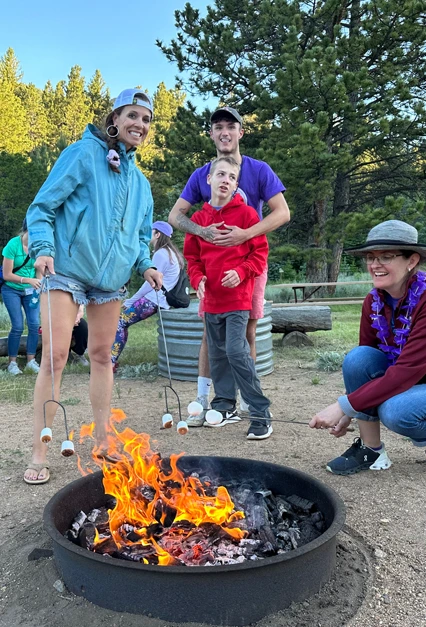 Family around camp fire